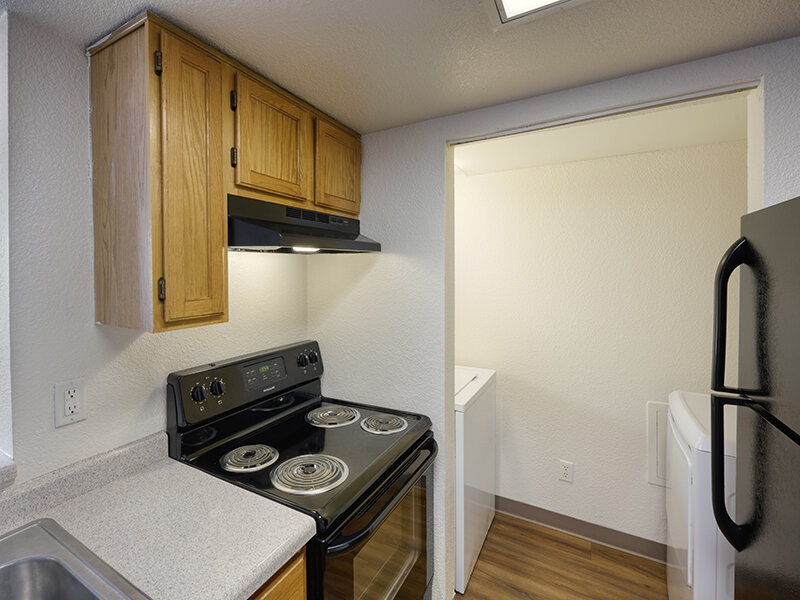 Apartment Stove with Wood Styled Cabinets | Dayton Meadows