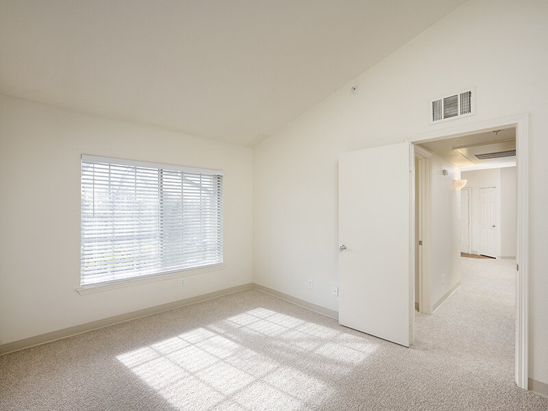 Bedroom with Window and Carpeted Flooring and Hallway | Dayton Meadows