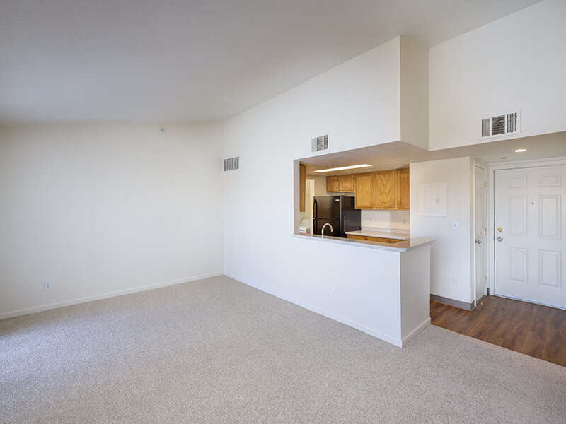 Apartment Entrance and Kitchen with Carpeted Flooring | Dayton Meadows