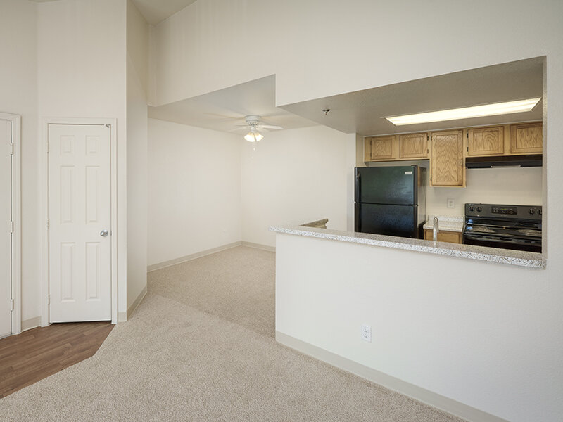 Kitchen Appliances and Living Room with Carpeted Flooring | Dayton Meadows