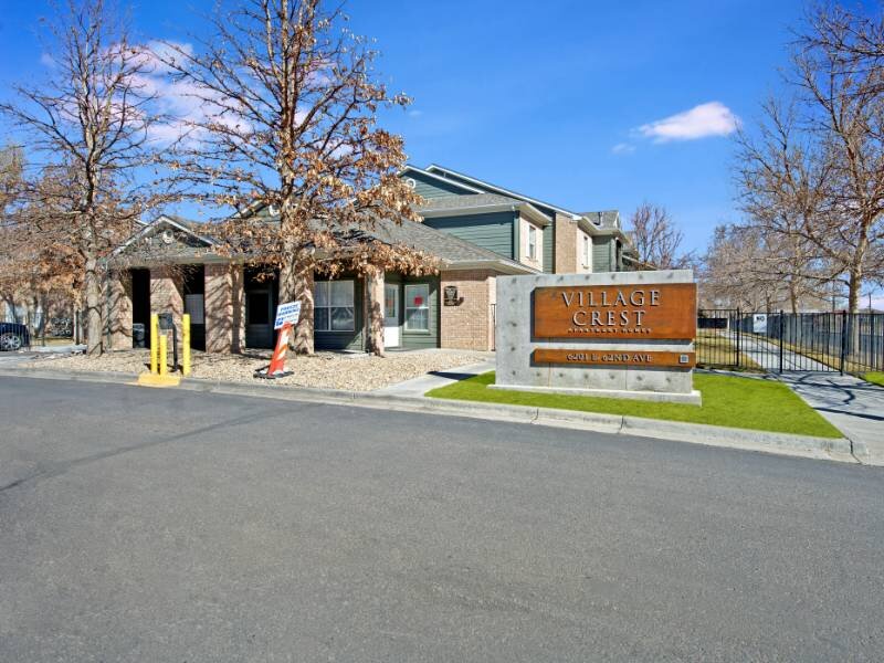 Monument Sign | Village Crest Apartments in Commerce City, CO
