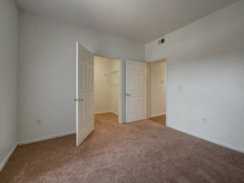 Bedroom | Village Crest Apartments in Commerce City, CO