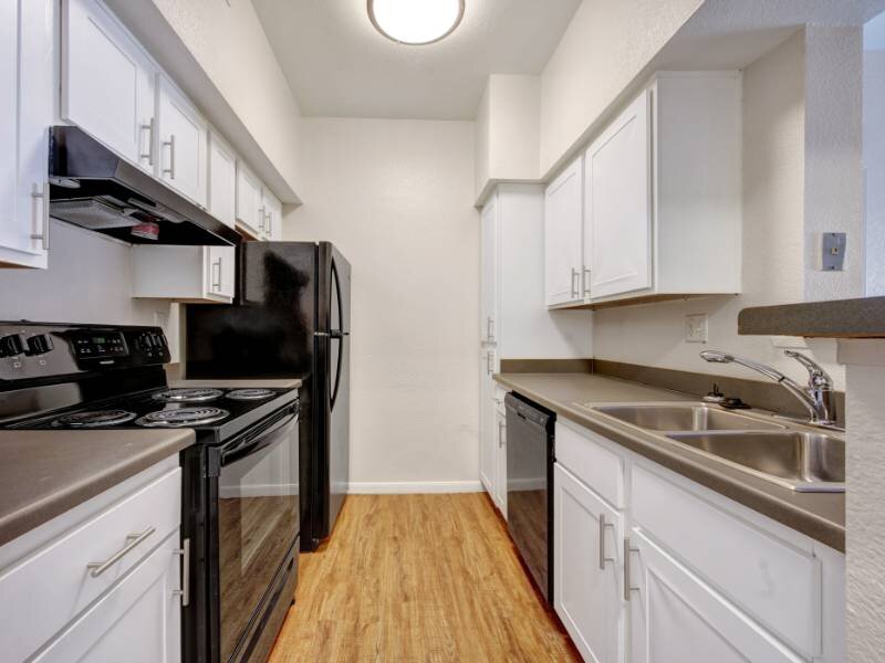 Fully Equipped Kitchen | Village Crest Apartments in Commerce City, CO