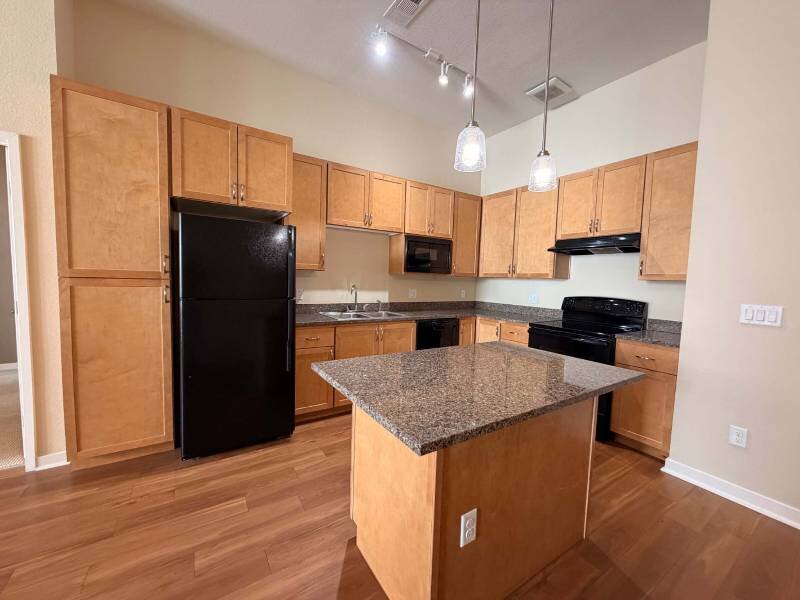 Fully Equipped Kitchen with Black Appliances | Residence at University Hills Apartments