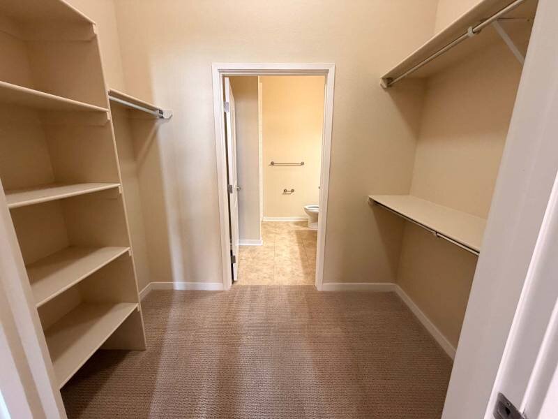 Walk In Closets with Built In Shelving | Residence at University Hills Apartments