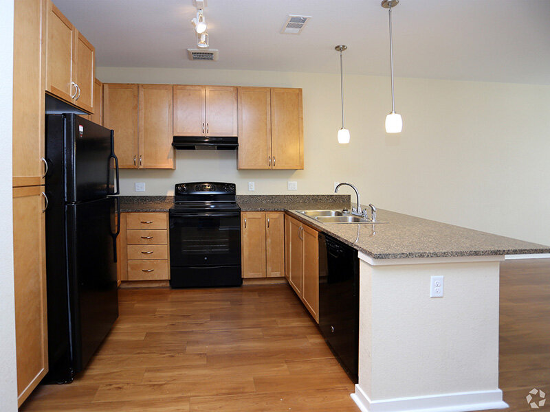 Kitchen with Wood Style Flooring | Residence at University Hills
