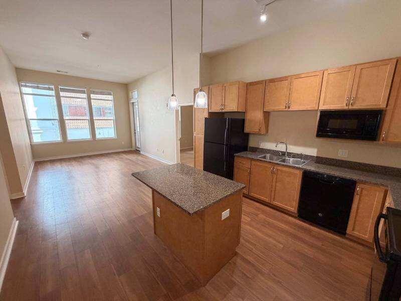 Kitchen and Living Room with Large Windows and High Ceilings | Residence at University Hills