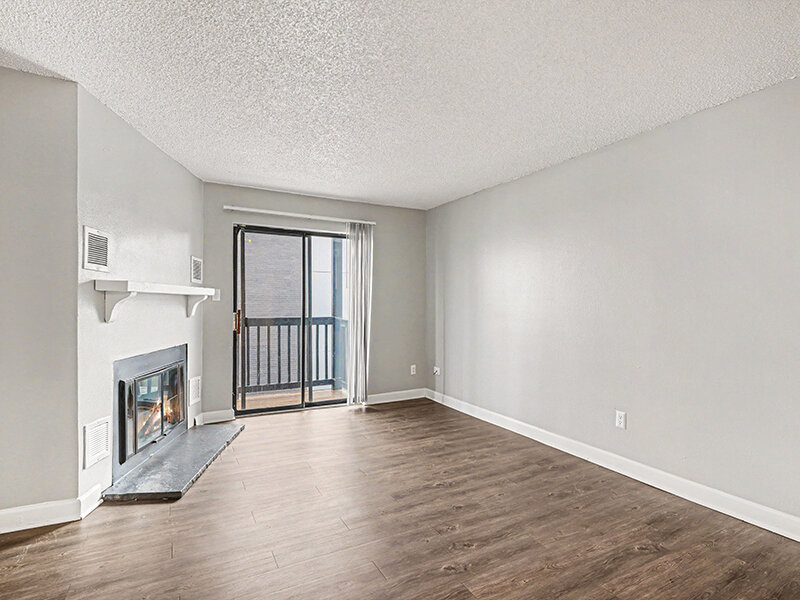 Living Room with Fireplace and Patio Door | Innovation at Fitz