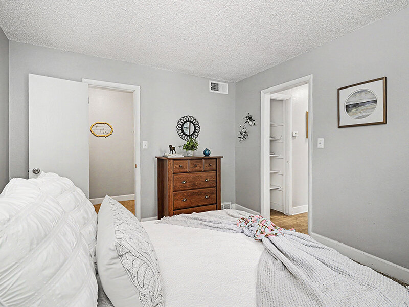 Bedroom with Dresser and Carpeted Flooring | Innovation at Fitz
