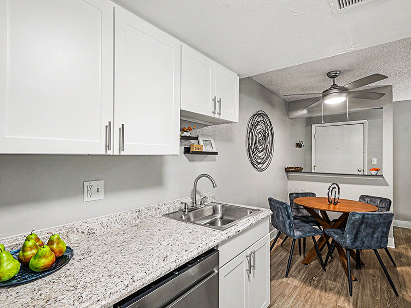 Kitchen Sink with Marbled Countertops and Wood Styled Flooring | Innovation at Fitz
