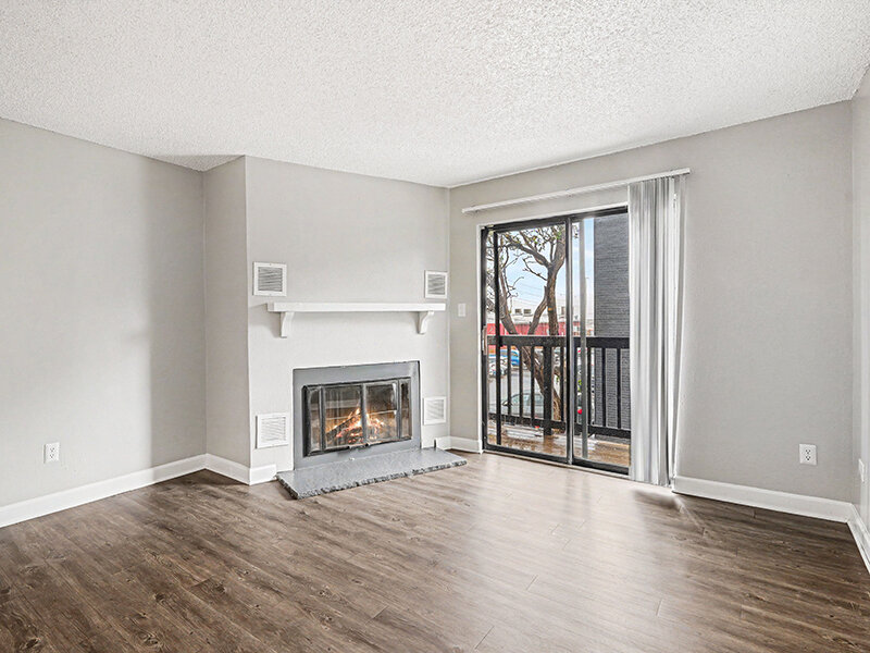 Living Room with Fireplace and Wood Styled Flooring | Innovation at Fitz