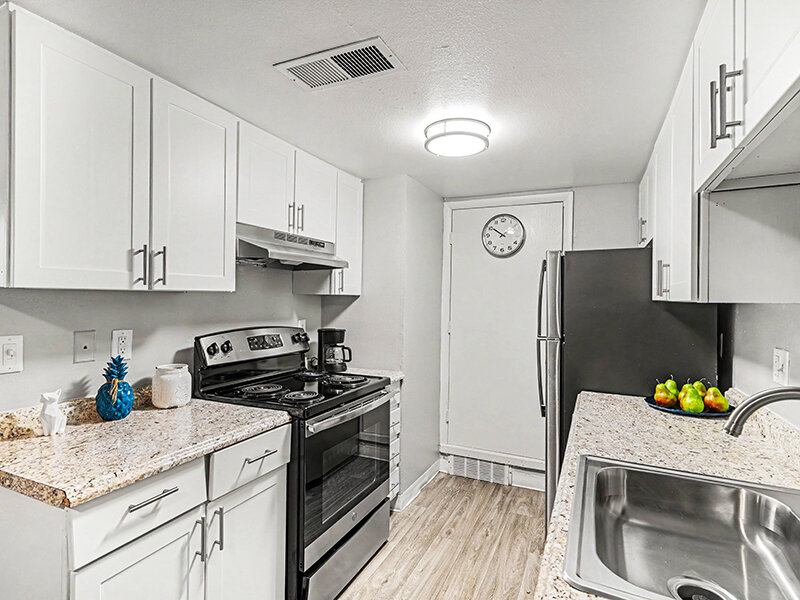 Kitchen with Wood Styled Flooring and Ceiling Light | Innovation at Fitz
