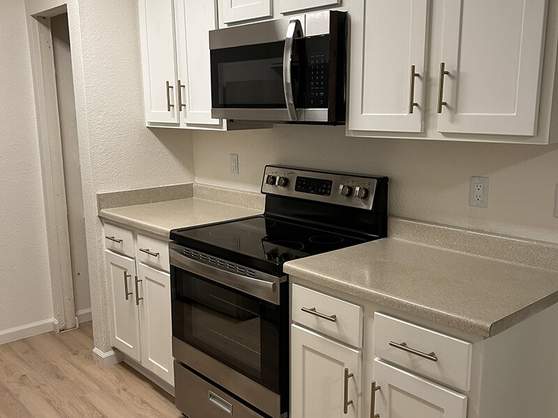 Kitchen Appliances with Wood Style Flooring | Berryhill