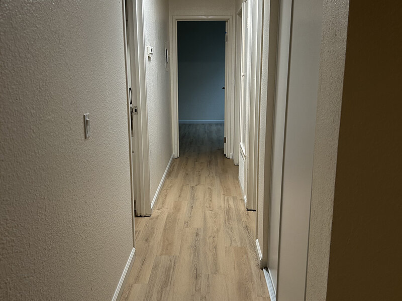 Apartment Hallway with Wood Style Flooring | Berryhill