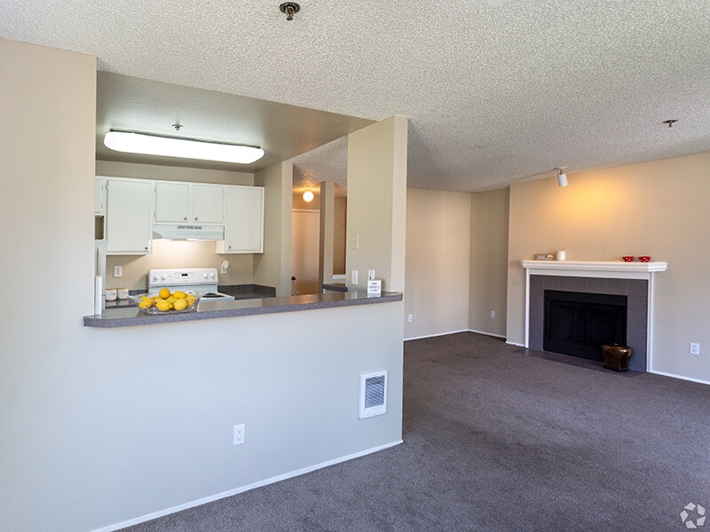 Living Room with Fireplace | Mallard Point at Riverbend Apartments