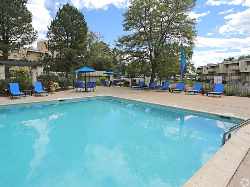 Swimming Pool with Poolside Furniture | The Parker Apartments