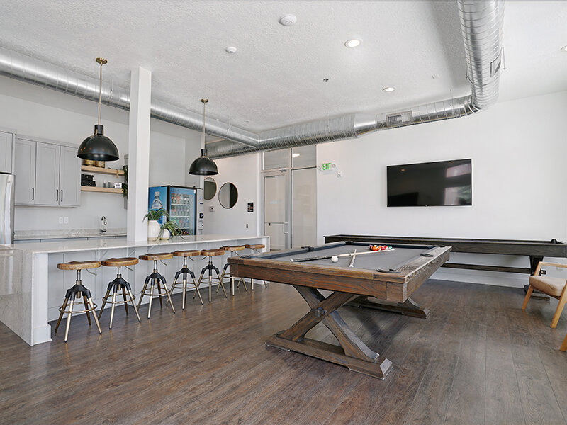 Community Pool Table with Television and Dining Area | Vida at Daybreak