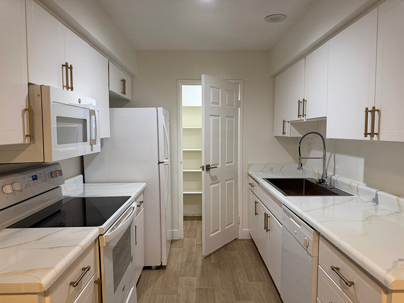Fully Equipped Kitchen with White Appliances and Matching Cabinetry | Morrell Park Apartments