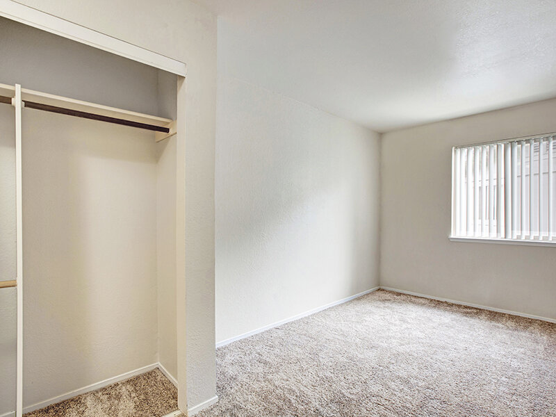 Carpeted Style Bedroom with Window and Closet | Arborelle Apartments