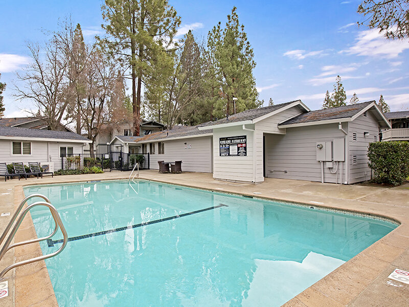 Outdoor Pool with Pool Chairs | Arborelle Apartments