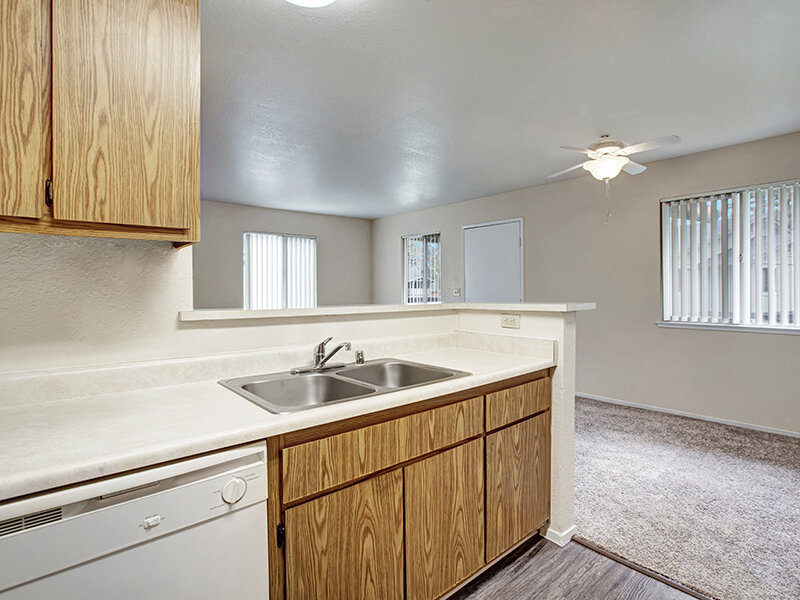 Kitchen Sink with Wood Style Cupboards | Arborelle Apartments