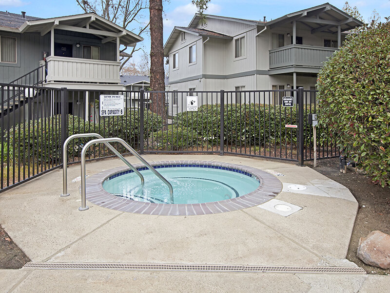 Hot Tub with Railings and Stone Style Flooring | Arborelle Apartments