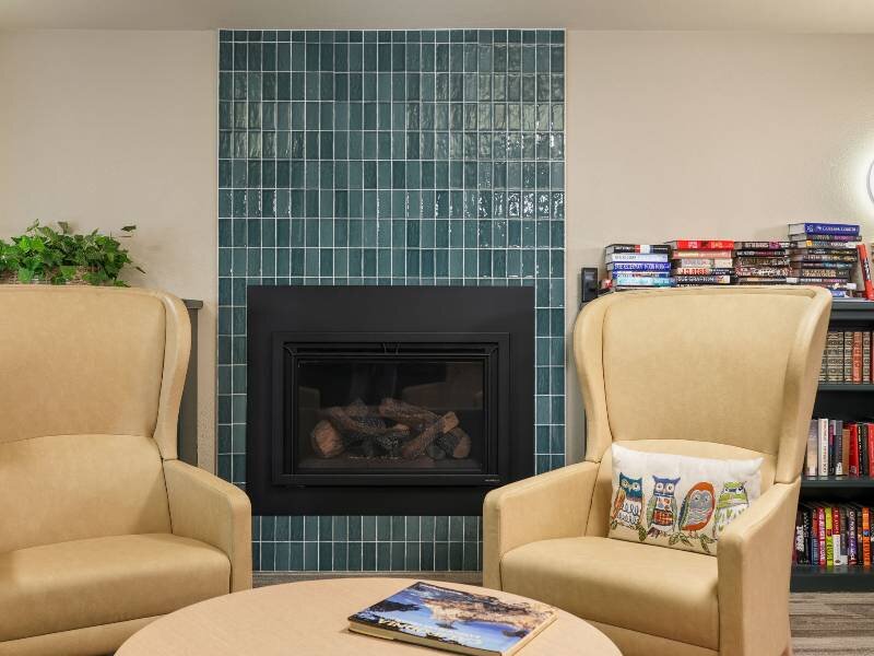 Reading Chairs Next to a Fireplace | Albert Einstein Apartments