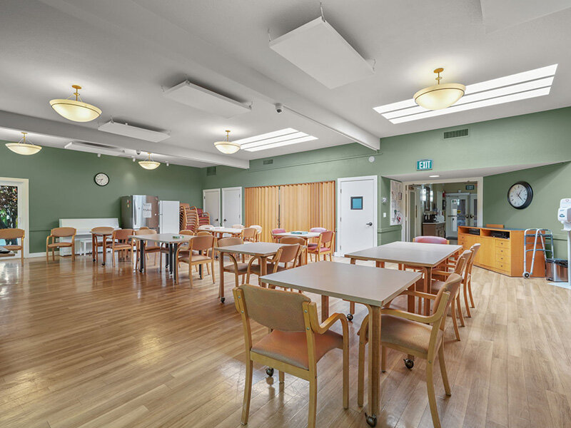 Community Seating with Ceiling Lights and Wood Styled Floors |  Parnow Friendship House