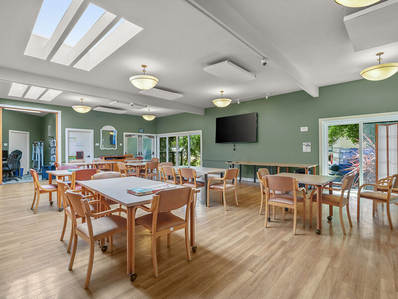Community Area with Television and Wood Styled Flooring |  Parnow Friendship House