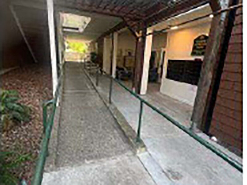 Sidewalk with Green Railing at Apartment Complex |  Parnow Friendship House