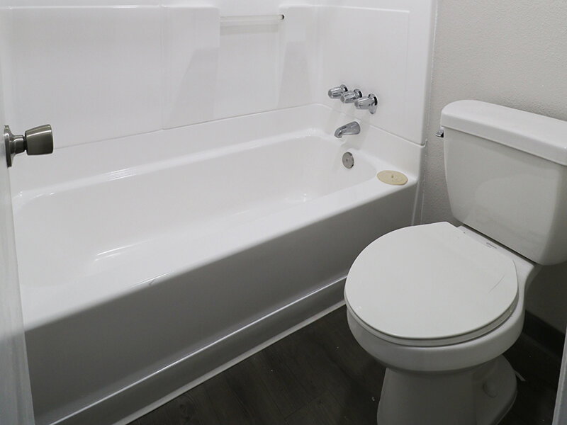 Bathroom with Shower and Wood Styled Flooring | Broadway Apartments