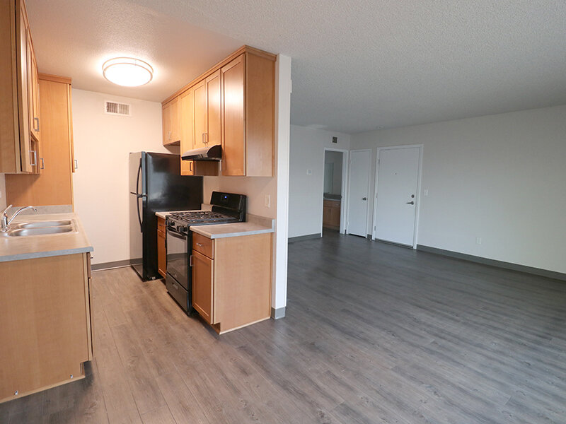 Kitchen with Wood Styled Flooring and Ceiling Lights | Broadway Apartments