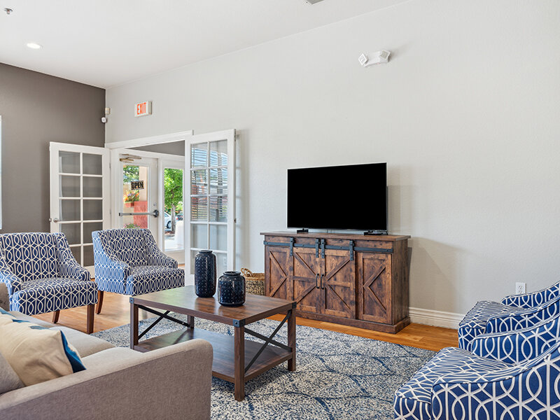 Community Seating with Television and Wood Style Flooring | Villa De San Felipe
