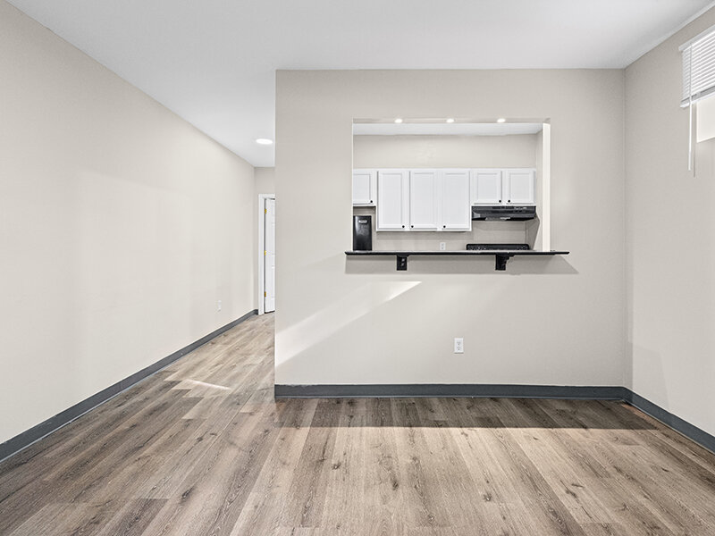 Living Room with Entrance to Kitchen and Wood Styled Flooring | The Mayflower
