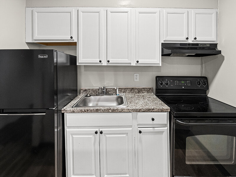Kitchen with Sink and Marble Styled Countertop | The Mayflower