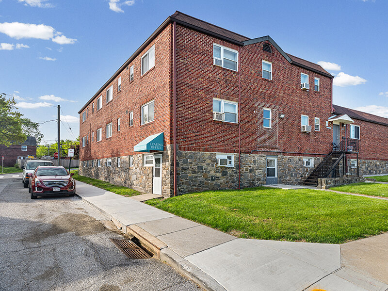 Exterior Apartment Complex with Parking and Sidewalk | The Mayflower