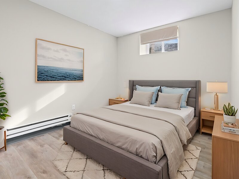 Bedroom with Wood Styled Flooring and Window | The Mayflower