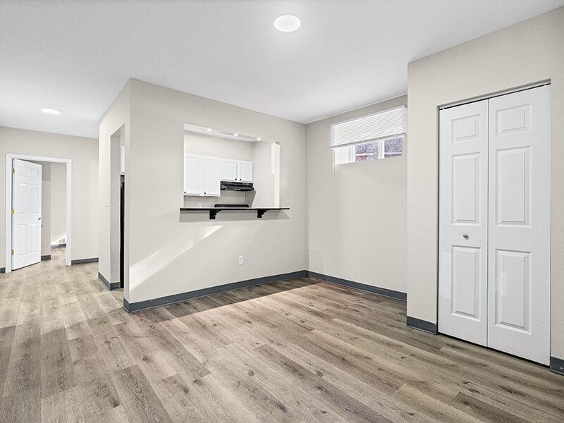 Living Room with Entrance to Kitchen with Window | The Mayflower