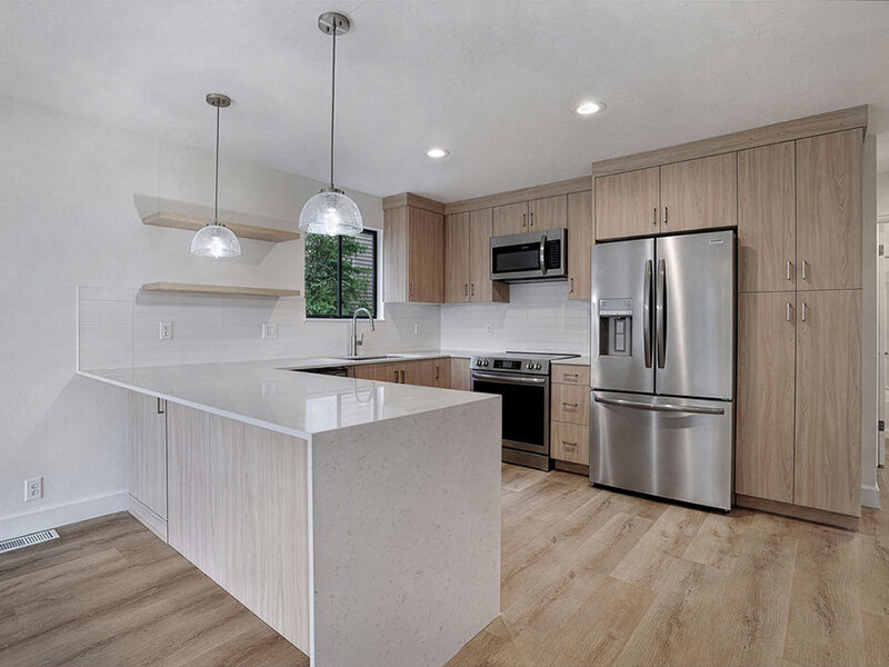 Kitchen and Wood Style Flooring with Ceiling Lights and Window | Residences at J Ranch