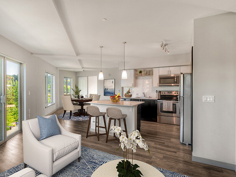 Kitchen and Living Room with Wood Style Flooring and Hanging Lights | Tria