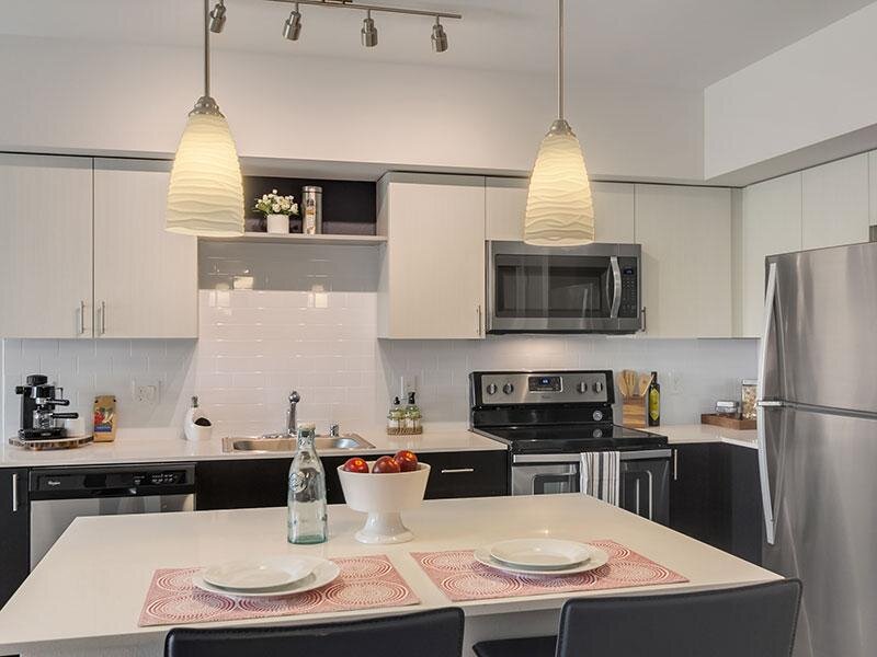 Kitchen with Hanging Ceiling Lights and Kitchen Table | Tria