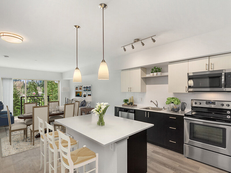 Kitchen with Hanging Lights and Wooden Flooring | Tria