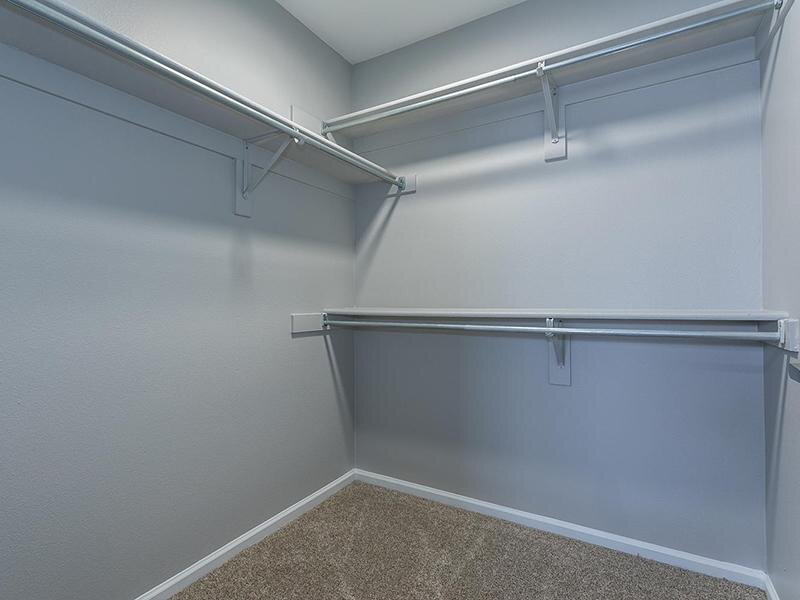 Closet with Rods for Clothing | The Bluffs at Castle Bluffs