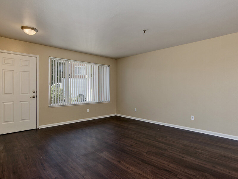 Living Room with Window and Wood Style Flooring | The Bluffs at Castle Rock