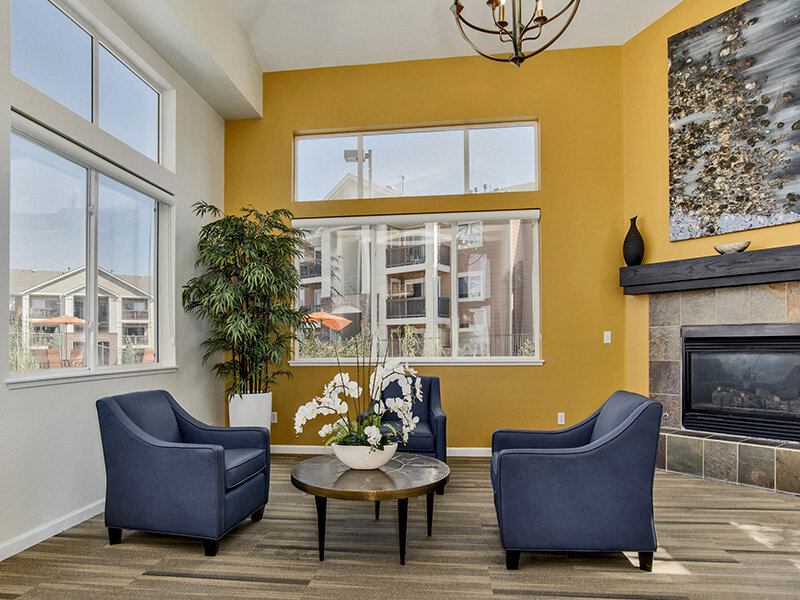 Community Center with Wood Style Flooring an with Fireplace and Windows | The Bluffs at Castle Rock