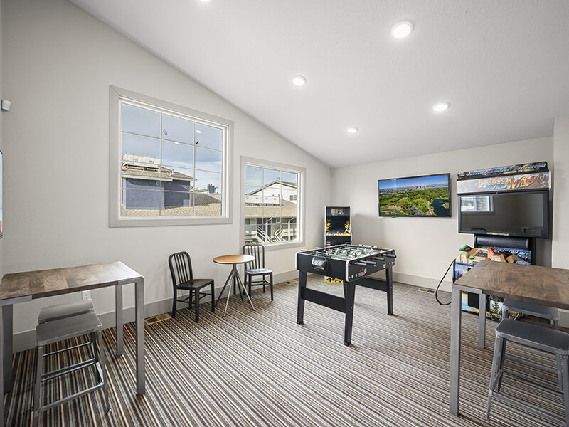 Community Game Room with Carpeted Flooring and Windows | Rosemont West 84th