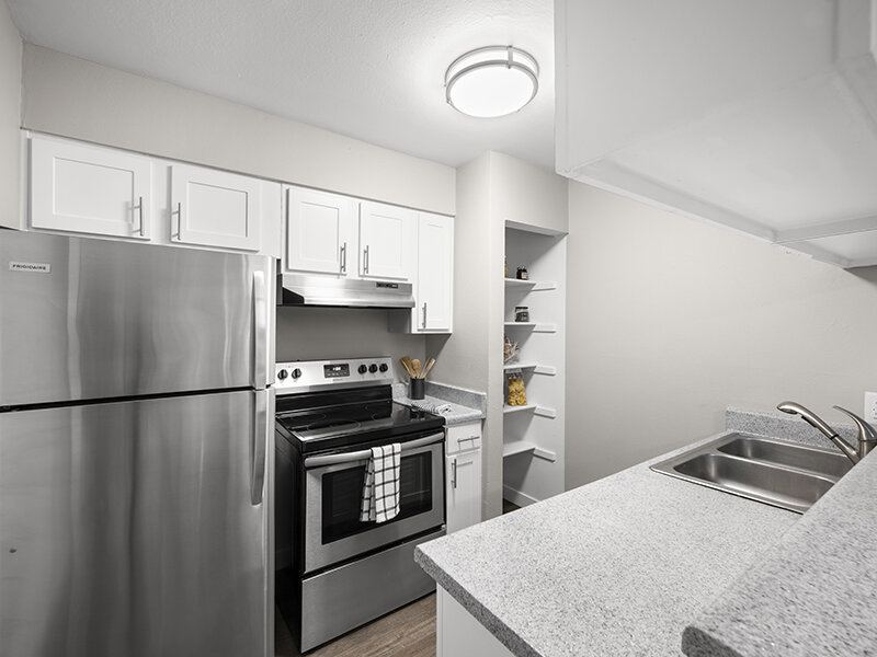 Kitchen Sink with Appliances and Wood Styled Cupboards | Rosemont West 84th