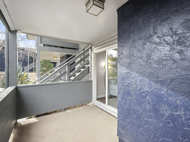 Apartment Patio with Ceiling Light and View to Stairwell | Rosemont West 84th