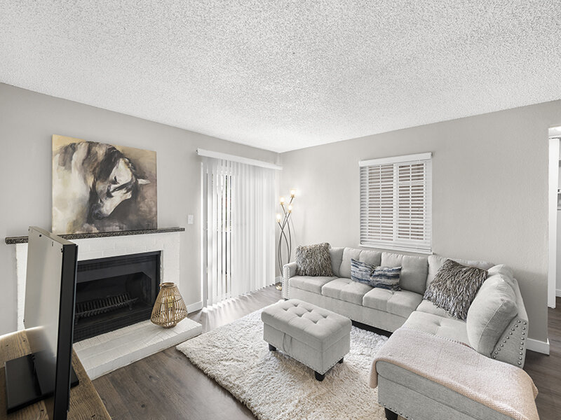 Sectional Couch with Wood Styled Flooring and Fireplace | Rosemont West 84th