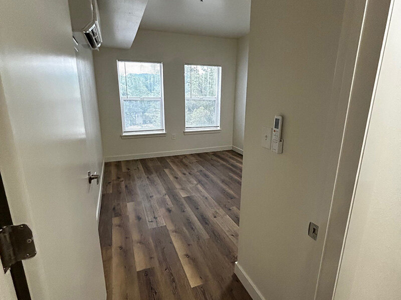 Bedroom with Wood Style Floors and Windows | Riverside